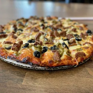 Isn&apos;t that a nice looking pie? A 10&quot; sausage and olive pizza. Delicious!