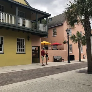 a woman walking down the sidewalk