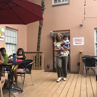 a woman holding a baby