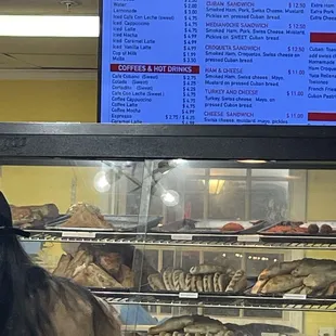 a woman standing in front of the counter