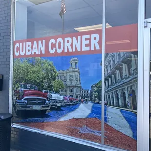 an old car parked in front of a building