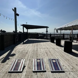 Corn hole on the deck with a water view