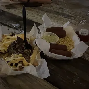 two baskets of food on a picnic table