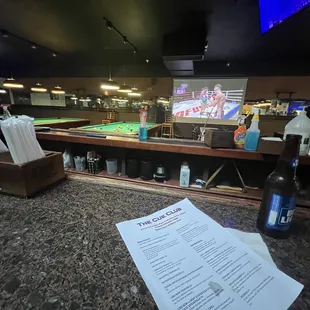a billiard's table with a billiard's table in the background
