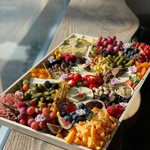 a platter of fruit and cheeses