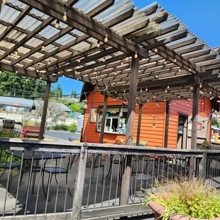 a patio with a pergol roof