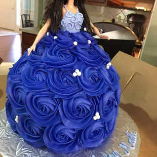 a doll in a blue dress