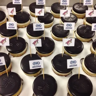 Vanilla cupcakes with a chocolate hockey &quot;puck&quot; to kick off the Phoenix Coyotes 2014-2015 season