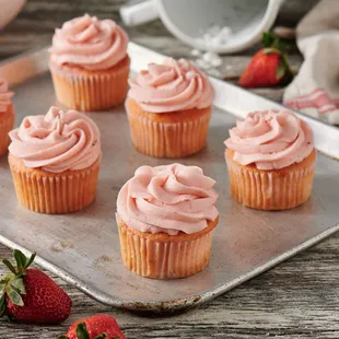 strawberry cupcakes with pink frosting