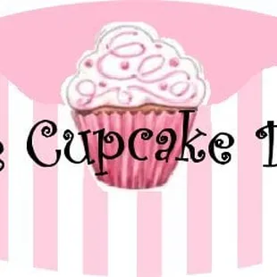 a pink cupcake with white frosting