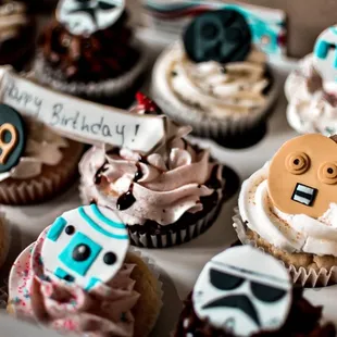 a variety of decorated cupcakes