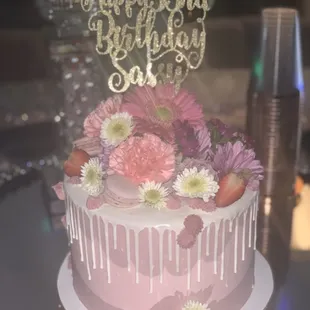 Strawberries &amp; Cream cake with fresh flowers and macaroons. (Cake topper not included.)