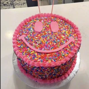 a smiley face made of sprinkles