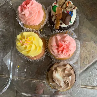 Yellow is Strawberry Banana, Mable is the swirl icing, Peach Bliss is the pink and Ya Killin' me is the one with toppings.