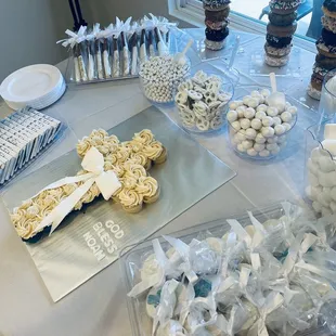 Dessert table I set up with mini cupcakes I ordered shaped as a cross for my nephews baptism