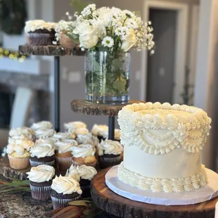 a cake and cupcakes on a table