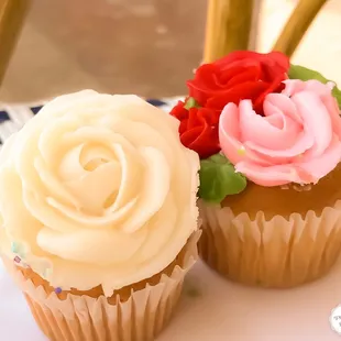White rose stems swirling around ribbons of rich charm to celebrate life&apos;s simple pleasures!