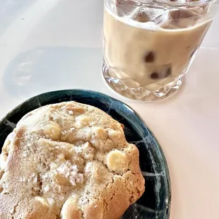 A white chocolate macadamia nut cookie w coconut and sea salt on top + The George w oat milk.