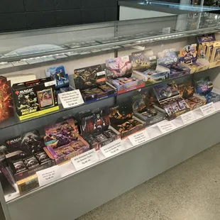 Magic the Gathering booster packs, a commander deck, and Lorcana stuff.