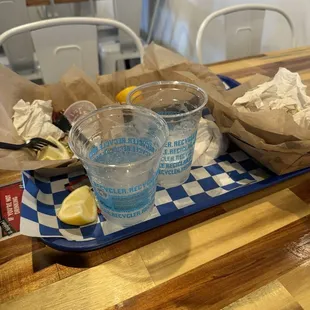 Fried Grouper w/ fries and Connecticut lobster roll w/ garlic fries. Hush puppies and shrimp fritters with current salad and fried scallops