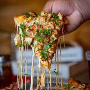 Butter chicken pizza slice
