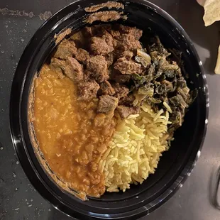 Lamb curry bowl with lentil and collared greens curry