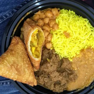 $13 Lamb Curry, came with lentil &amp; chickpea curry + vivid rice. $6 vegan samosas. Mildly spicy.