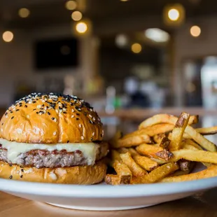 &quot;THE CUT&quot; 60 Day Dry Aged Ribeye Patty, 2 Year Aged White Cheddar on a Black &amp; White Sesame Seed Potato Bun.