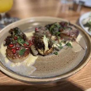 Scallops with Brussels sprouts and pomegranate.