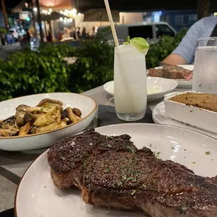 Kiawe Grilled Ribeye Steak, Mushroom Medley (Ali'i, Shimeji, &amp; Shiitake), Whipped Okinawan Potatoes &amp; Coconut Mojito.