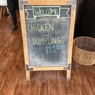 a chalk board with a welcome sign