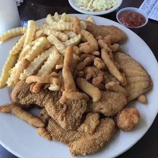 Seafood platter.   Catfish strips, flounder, shrimp, clam strips, fries and slaw.