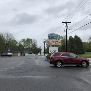 a red car parked in a parking lot