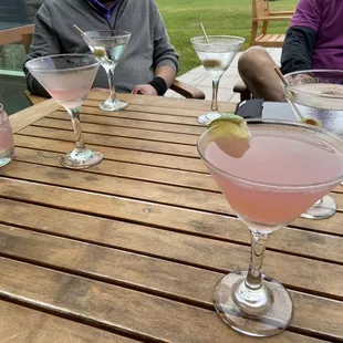 three cocktails on a wooden table