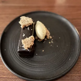Flourless Chocolate Cake Madeira Ice Cream, Pecan Praline, Sour Cherry