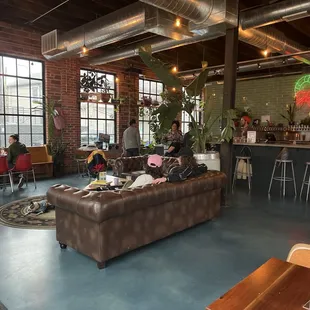 people sitting at tables in a restaurant