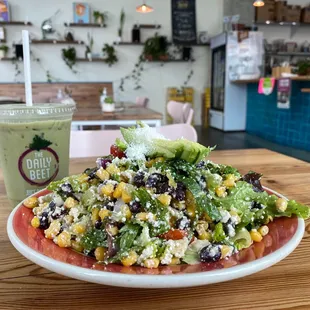 a plate of salad and a drink