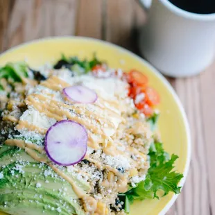 a plate of food and a cup of coffee