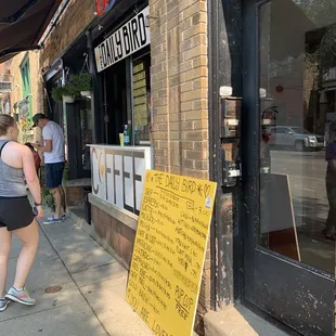 a woman walking down the sidewalk