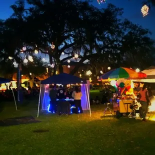 More lights. Love the vibes at the park area behind the food trucks