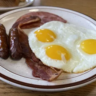 Breakfast 3. Three Eggs with 2 Bacon, 2 Sausage and Ham Special