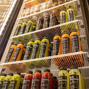 Grab N Go Fridge stocked with cold-pressed juices, protein bites, wellness shots, kombucha and micro greens.