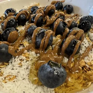 Blueberry smoothie bowl topped with almond butter