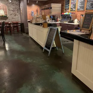 a coffee shop with a chalkboard sign
