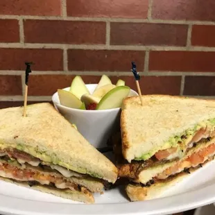 a sandwich and a bowl of fruit