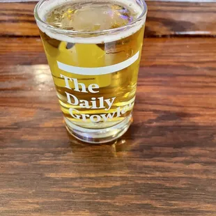 a glass of beer on a table