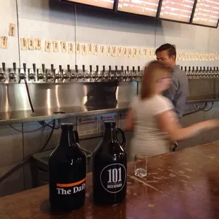 a man and a woman at a bar