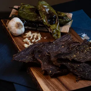a cutting board with a variety of food items