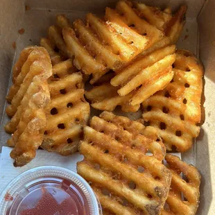 a box of french fries and ketchup