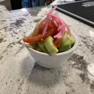 a salad in a white bowl